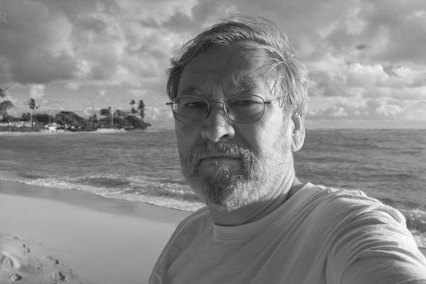 Self-portrait at 60, camera hand held at arms length.